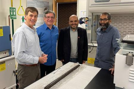 Four professors pose for the camera